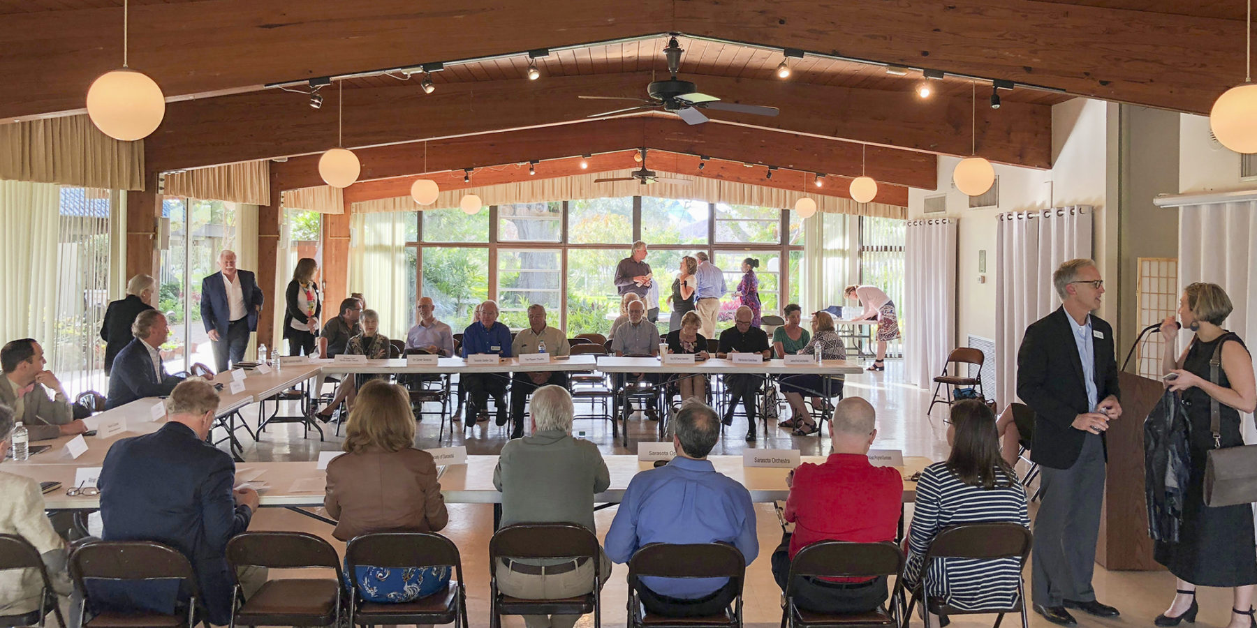 a group meets under a pavilion