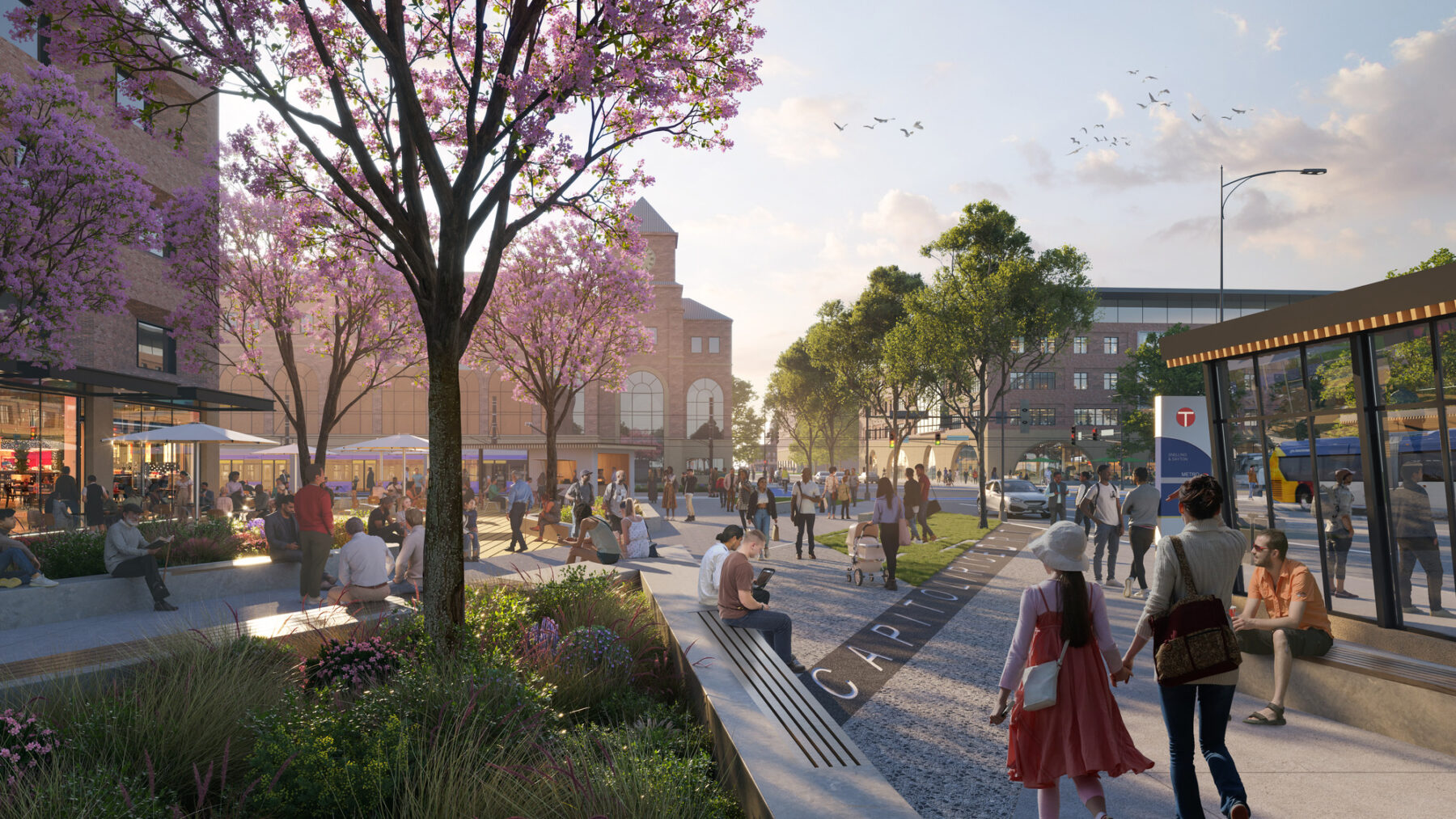 rendering of new University and Rice intersection, featuring mobility hub, several new mixed use buildings, and ample pedestrian space