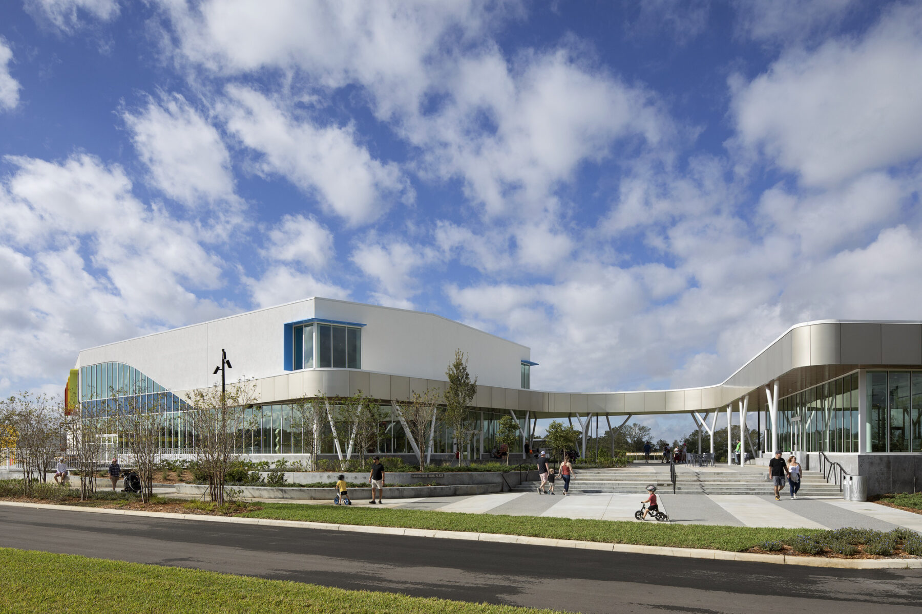 Facade of Children's Museum and Cafe showcasing the gateway into the lawn