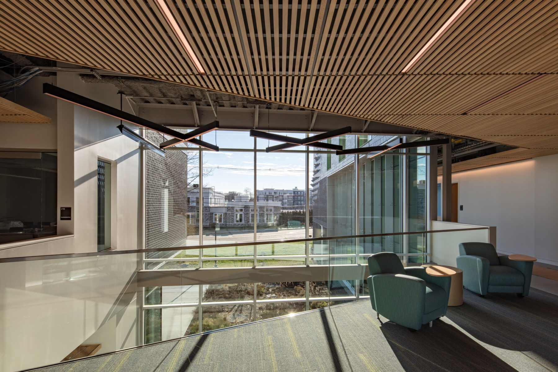 photograph of student seating on second floor overlooking the lobby featuring large windows