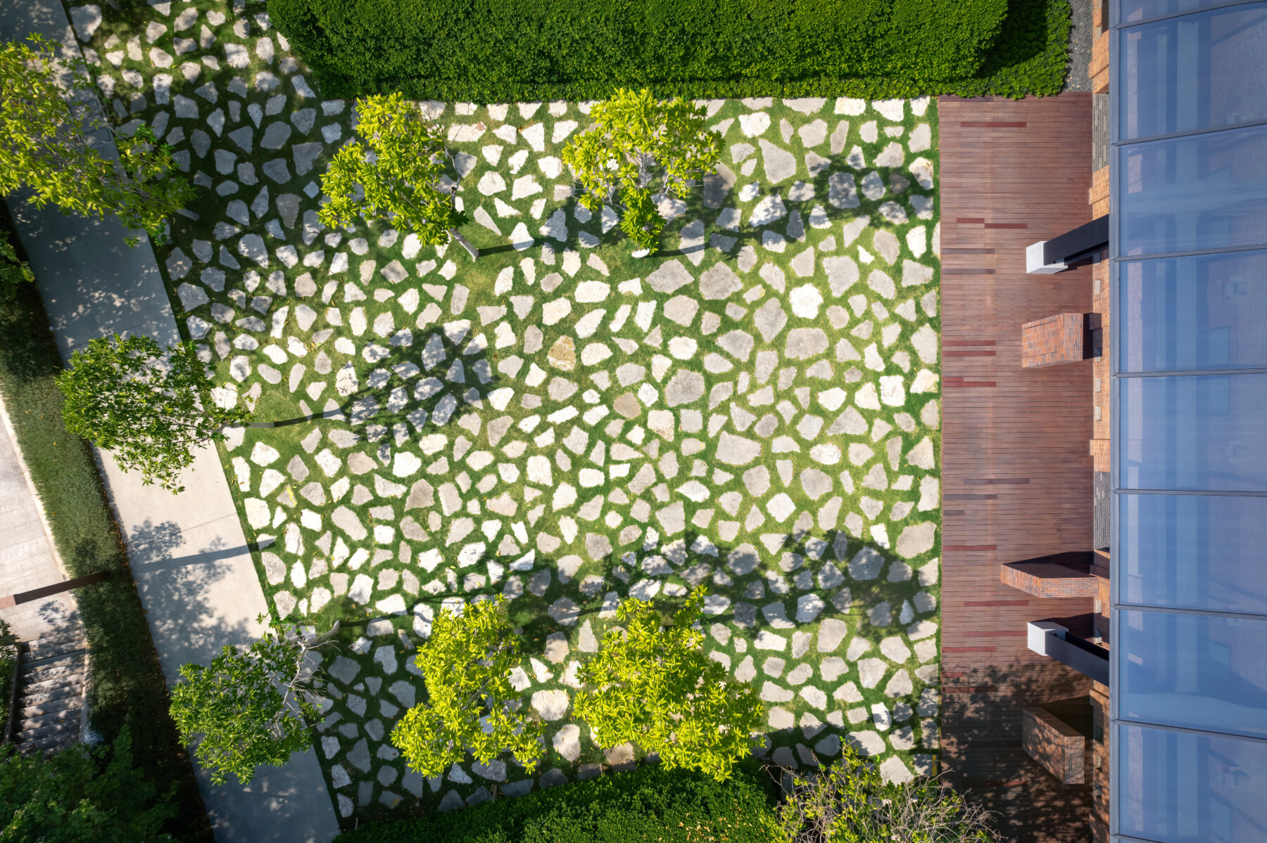 Aerial photo of mosaic patterned pavement with salvaged concrete blocks